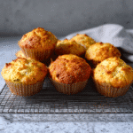 Golden brown cottage cheese muffins on rustic plate